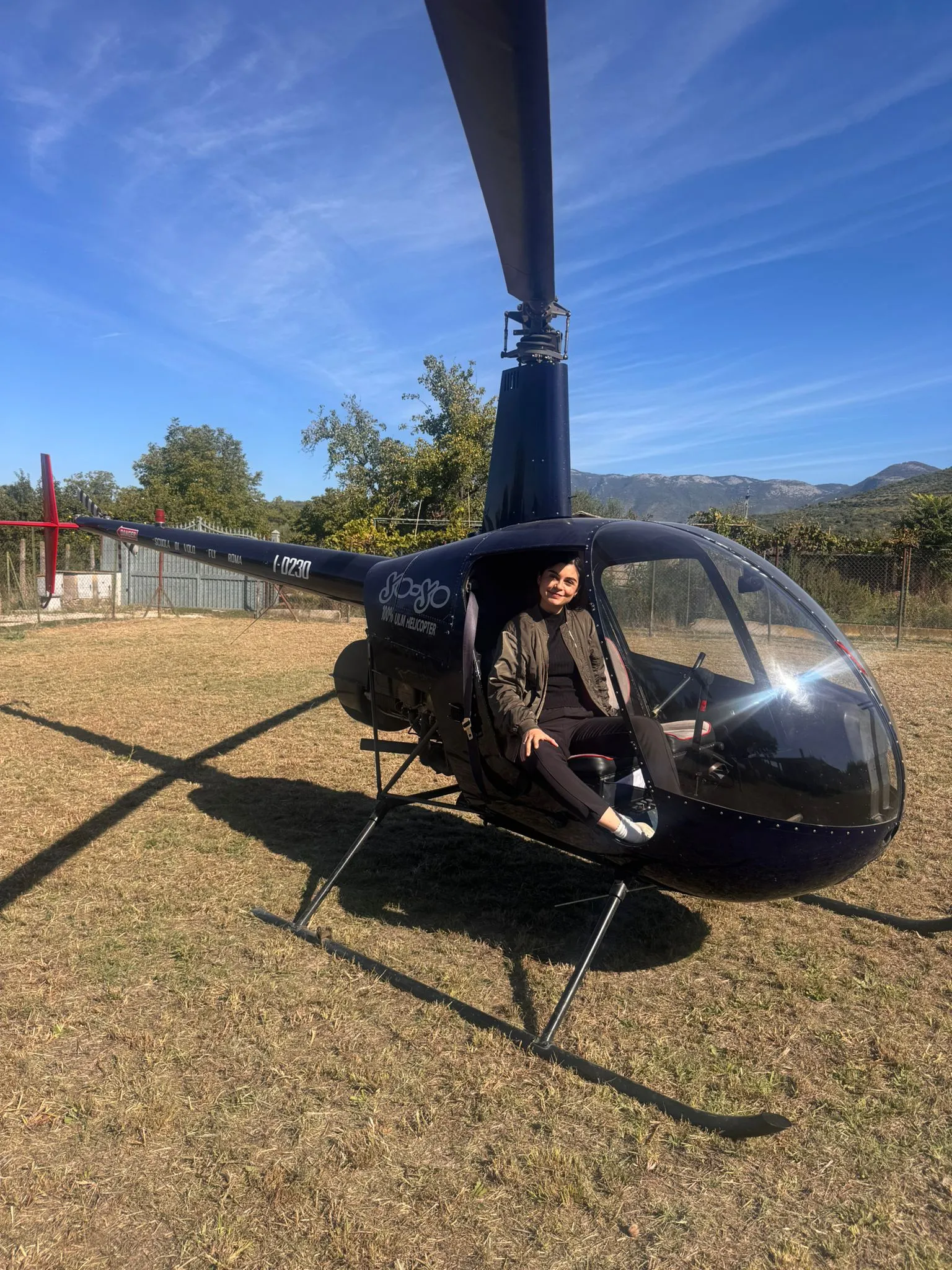 Valentina sitting in a helicopter